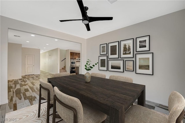 dining room featuring light wood-type flooring, visible vents, recessed lighting, stairway, and ceiling fan