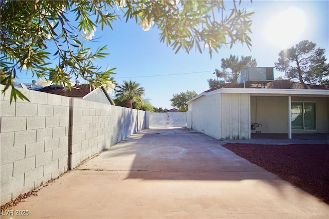 exterior space with fence and a gate