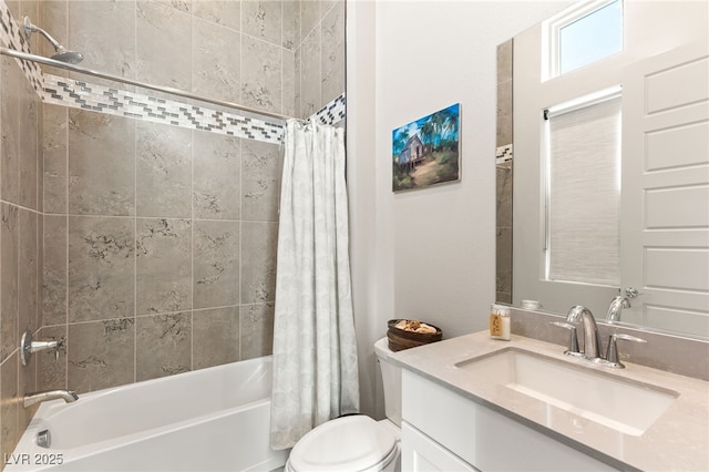 bathroom with toilet, shower / tub combo, and vanity