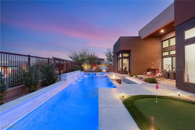 view of pool featuring a patio area, a fenced backyard, a jacuzzi, and a fenced in pool