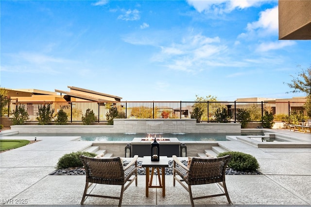 view of swimming pool with a fire pit, a patio area, and a fenced backyard