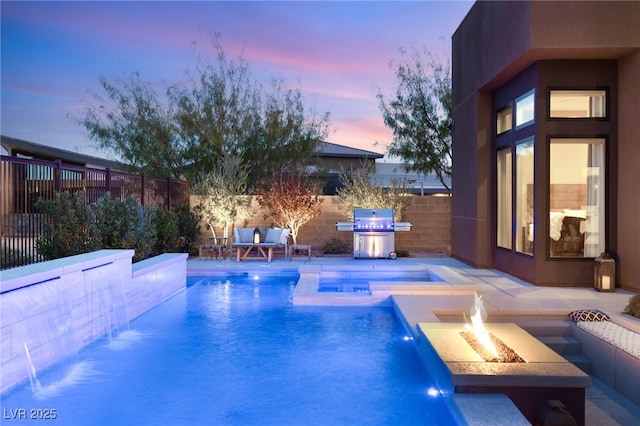 pool at dusk with an outdoor fire pit, a fenced backyard, grilling area, a fenced in pool, and a patio area