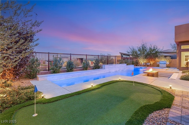 view of swimming pool with a patio, grilling area, a fenced backyard, and a fenced in pool