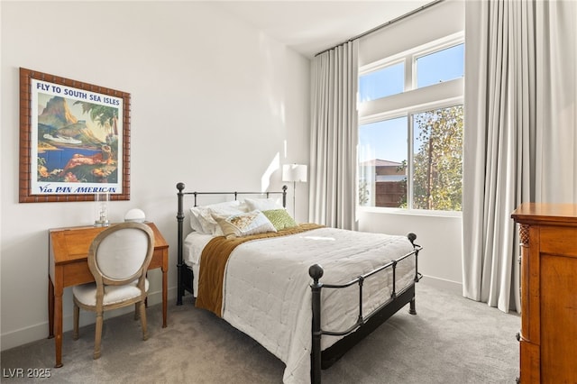 bedroom with carpet flooring and baseboards