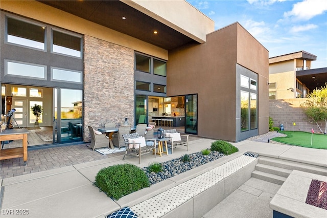 view of patio featuring fence and french doors