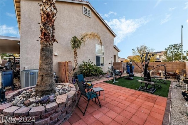 view of patio / terrace featuring fence and cooling unit