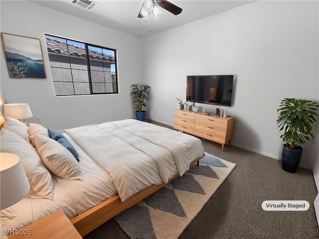 carpeted bedroom with visible vents, baseboards, and ceiling fan