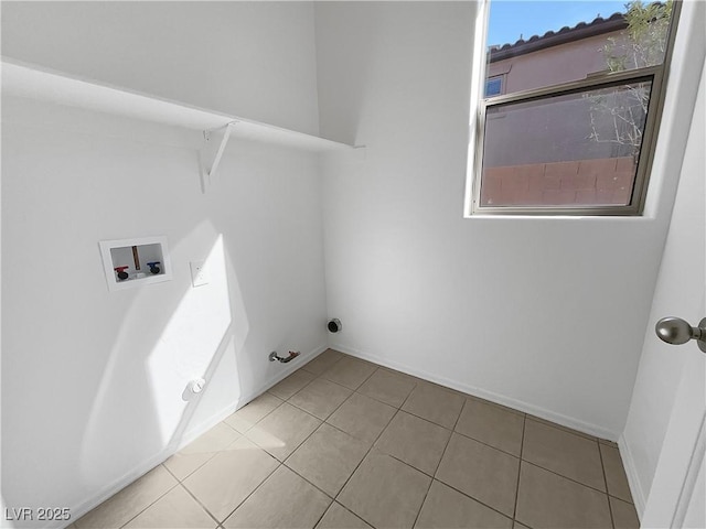 laundry area with hookup for a gas dryer, laundry area, washer hookup, baseboards, and tile patterned floors