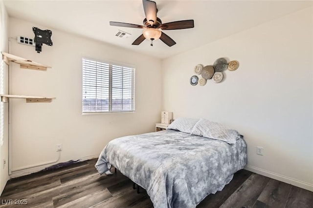 bedroom featuring a ceiling fan, dark wood finished floors, visible vents, and baseboards