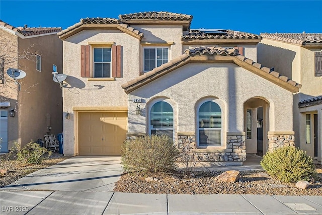 mediterranean / spanish-style house featuring a garage, a tile roof, driveway, stone siding, and stucco siding