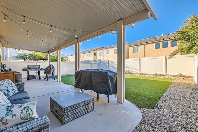 view of patio with a fenced backyard, an outdoor living space, and area for grilling