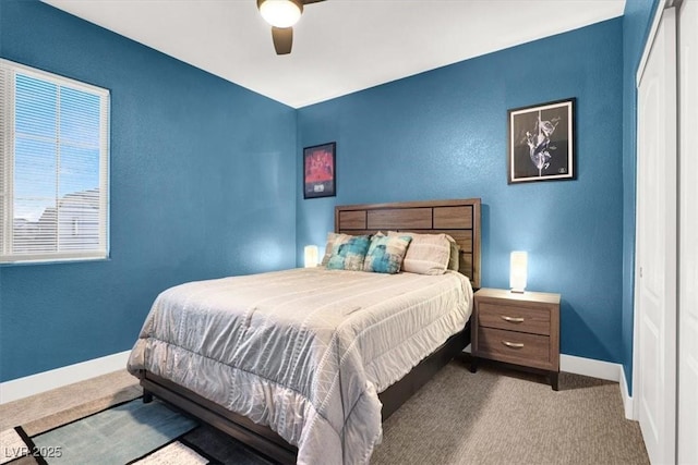 bedroom featuring ceiling fan, baseboards, and carpet flooring