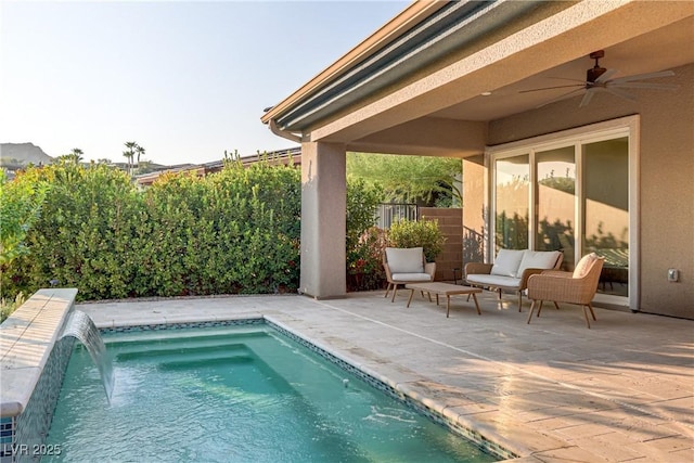 outdoor pool with a ceiling fan, a fenced backyard, and a patio