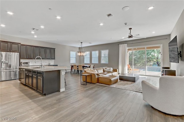 interior space with light wood finished floors, a toaster, visible vents, and recessed lighting