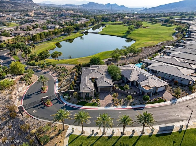 drone / aerial view with a water and mountain view