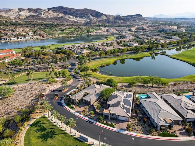 aerial view featuring a residential view and a water and mountain view