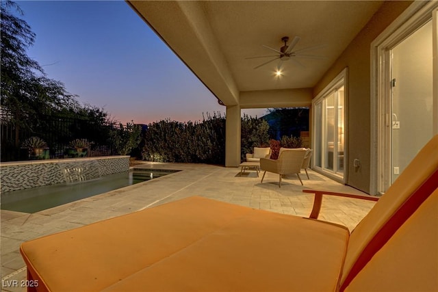 view of patio featuring a fenced backyard and ceiling fan