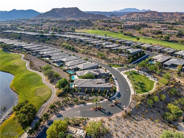 birds eye view of property featuring a residential view and a water and mountain view