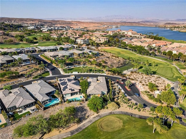 aerial view featuring view of golf course, a water view, and a residential view