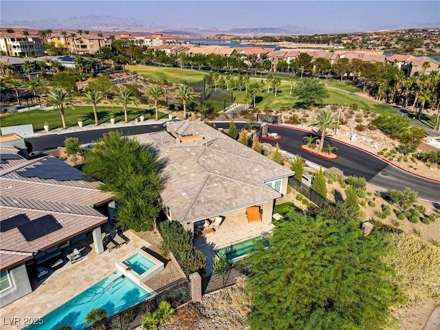 birds eye view of property featuring view of golf course and a residential view