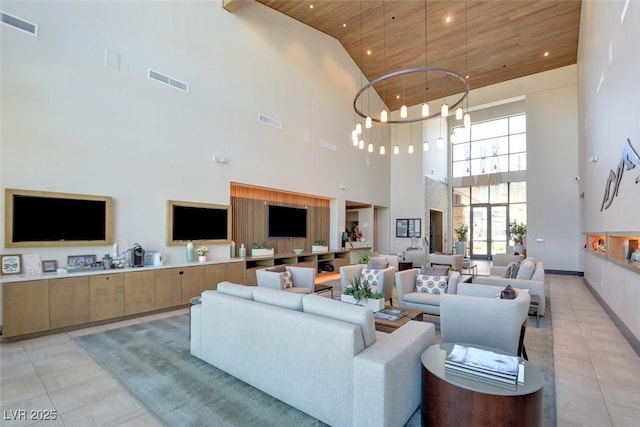 living room with visible vents, light tile patterned floors, wood ceiling, and an inviting chandelier