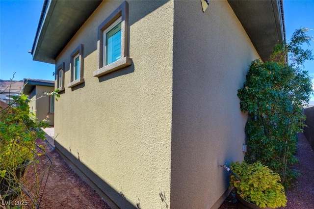 view of home's exterior with stucco siding