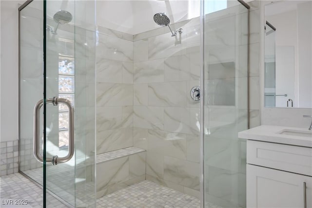 full bath featuring a stall shower and vanity