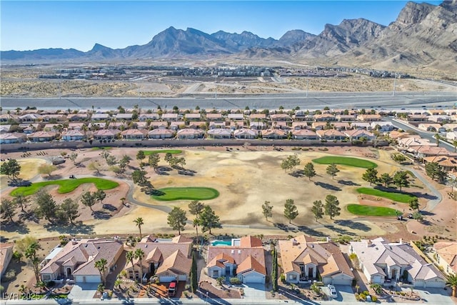 aerial view with view of golf course, a residential view, and a mountain view