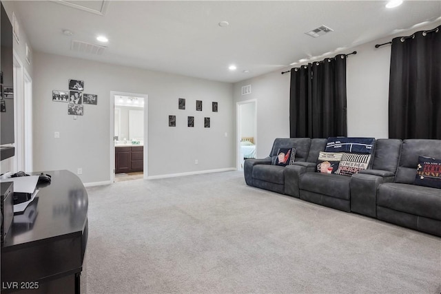 living area with recessed lighting, light carpet, and visible vents