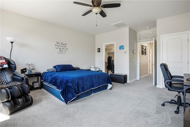 bedroom featuring visible vents, baseboards, a ceiling fan, a spacious closet, and carpet