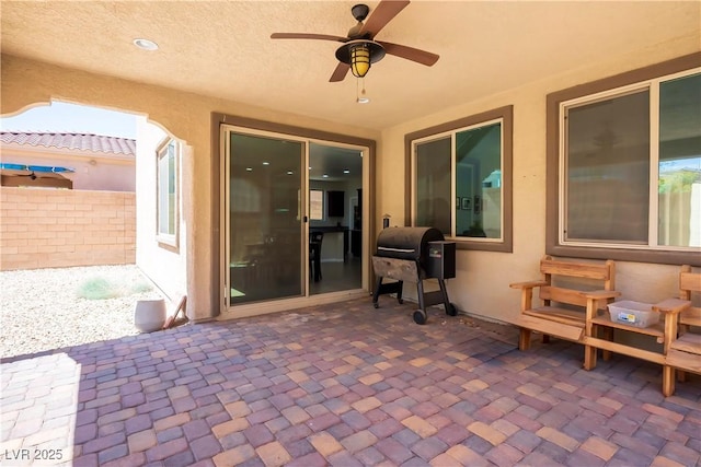 view of patio featuring ceiling fan