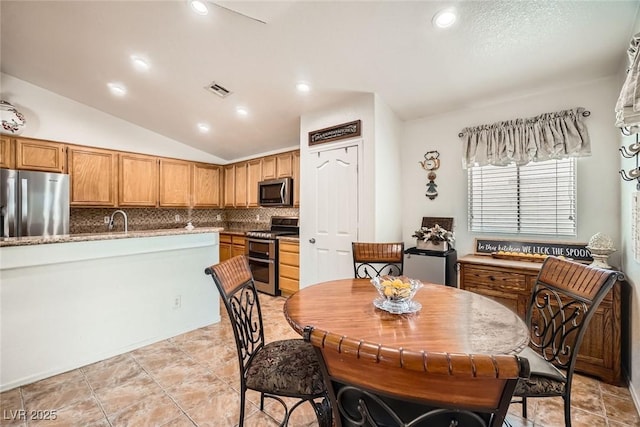 dining space with visible vents, recessed lighting, and lofted ceiling