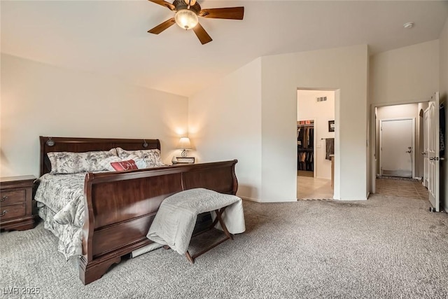 bedroom featuring visible vents, a ceiling fan, carpet flooring, and vaulted ceiling