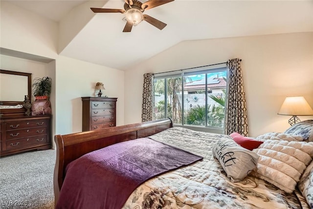 carpeted bedroom featuring ceiling fan and vaulted ceiling