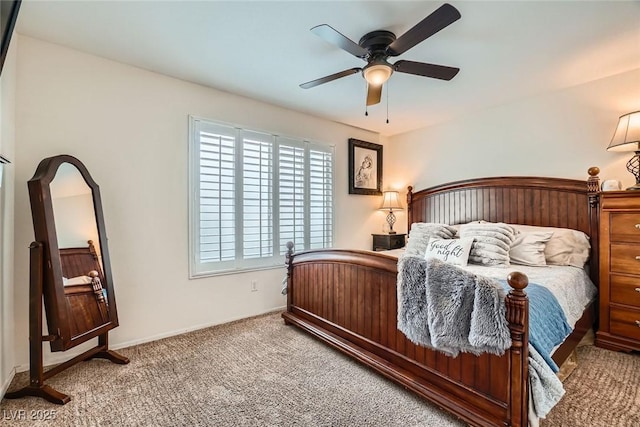 bedroom with baseboards, carpet floors, and ceiling fan