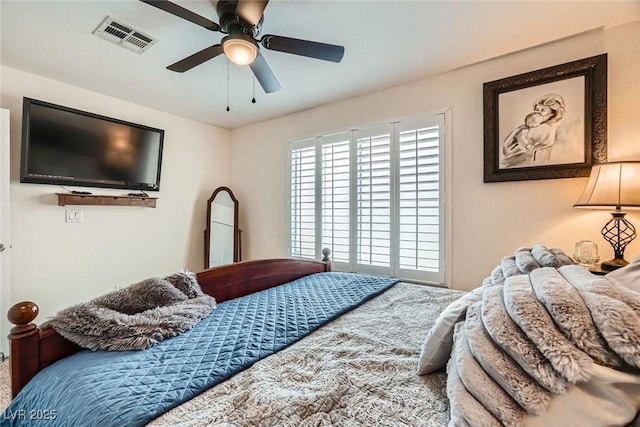 bedroom featuring visible vents and a ceiling fan