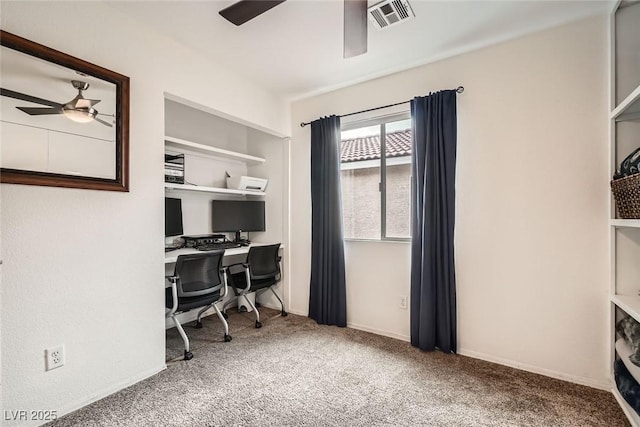 office featuring carpet flooring, a ceiling fan, and visible vents