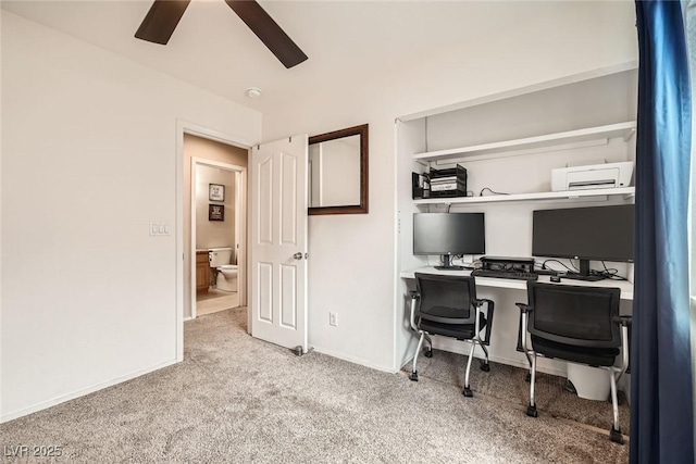 home office with baseboards, ceiling fan, and carpet flooring