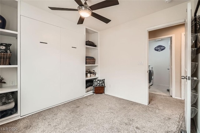 bedroom with washer / dryer, carpet flooring, and a ceiling fan