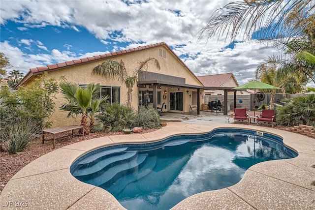 view of pool featuring a patio area, a fenced in pool, and fence