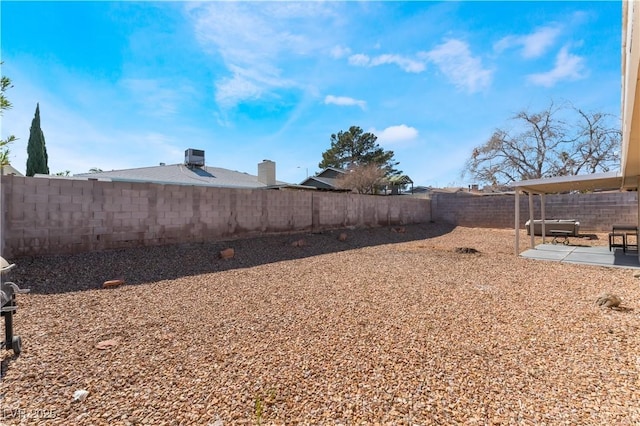 view of yard with a patio area and a fenced backyard