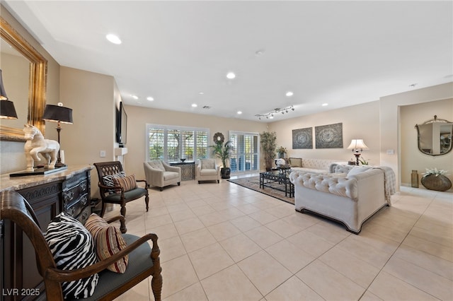 living room featuring light tile patterned floors, a fireplace, and recessed lighting