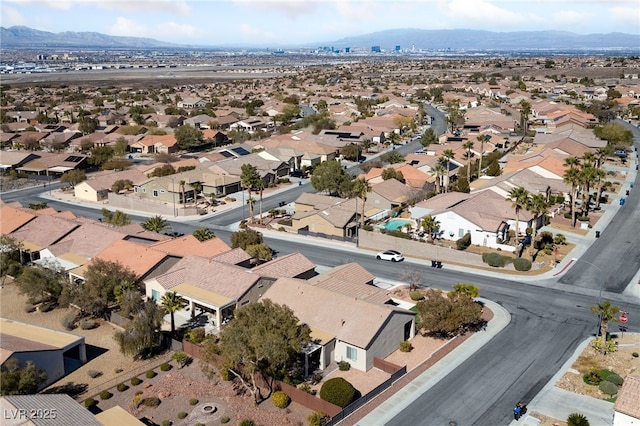 drone / aerial view featuring a residential view and a mountain view