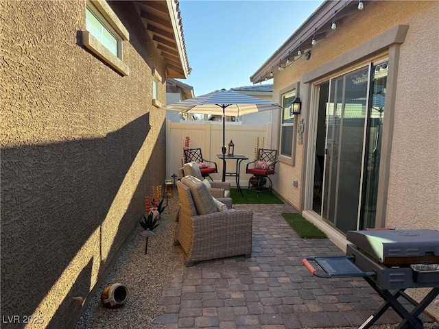 view of patio / terrace featuring fence and grilling area