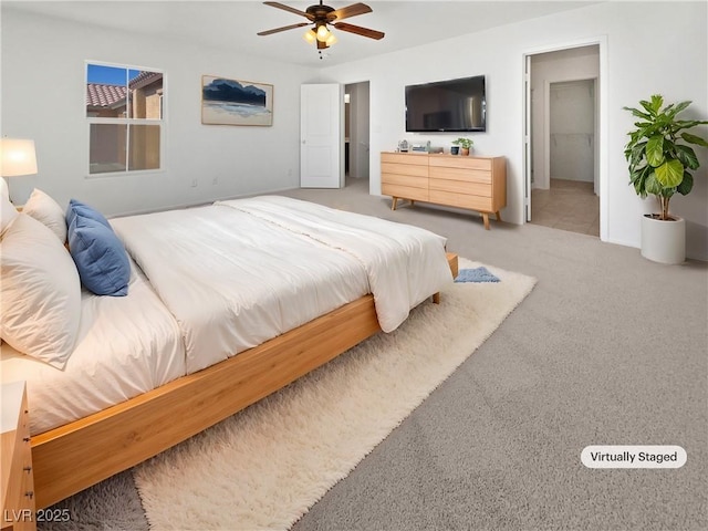 carpeted bedroom featuring ceiling fan