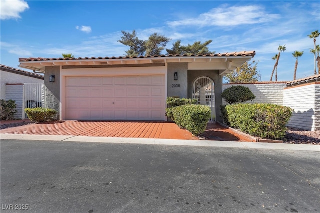 view of front facade with an attached garage, decorative driveway, and stucco siding