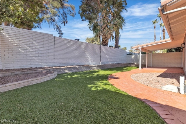 view of yard with a fenced backyard and a patio