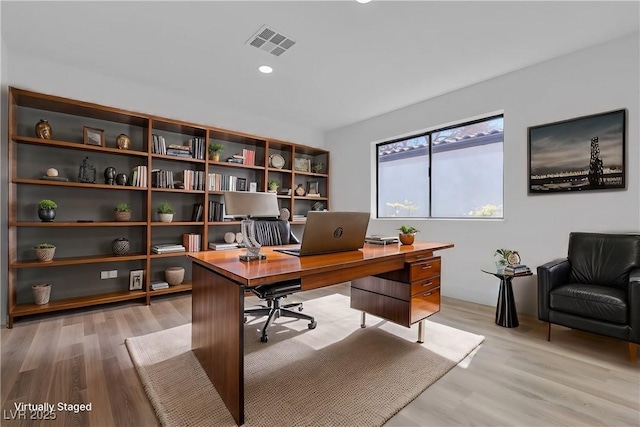 office with light wood-style flooring, visible vents, and recessed lighting