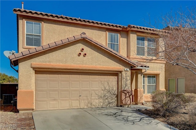 view of front of house featuring stucco siding, a garage, and concrete driveway