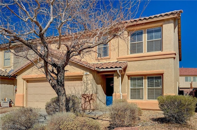 view of front facade with stucco siding and a tile roof